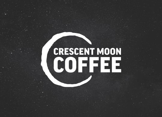 The Crescent Moon Coffee logo placed on the night sky