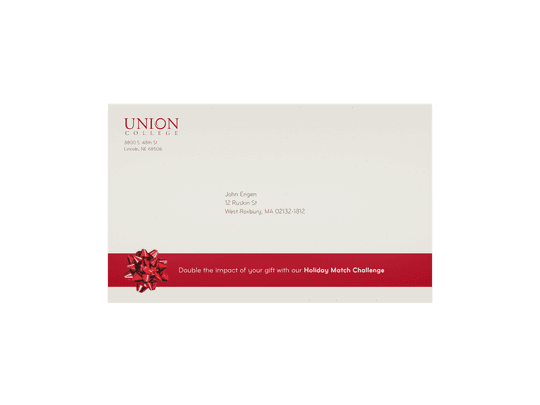 The main trifold, folded, showing the side with the send and receive addresses. Bottom design reads: “Double the impact of your gift with our Holiday Match Challenge”